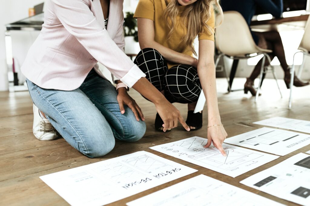 Businesswoman planning a project on the floor